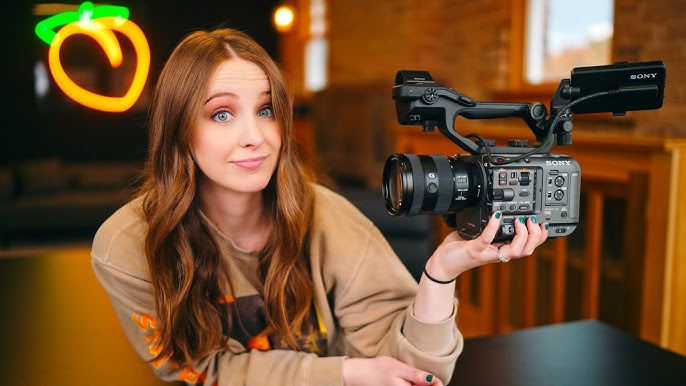 youtube influencer holding Sony FX6 Camera JPEG